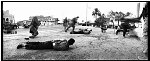 April, 14th. 2003, N-Iraq, Tikrit. During the first evening Troops inspect cars passing by on weapons or hostile attacks. Some man are arrested because in their car were 16 AK 47 automatic rifles found, and hand grenades, during their arrest gunfire is starting.